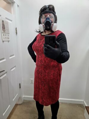 Trying on another outfit.  This one wasn't quite as form-fitting as the other one, though it still showed off contours around my middle that I didn't want to show.  Another strike against this dress, though, was that it was just plain ugly.