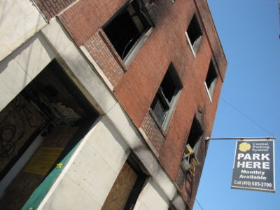 East facade, looking up from the sidewalk immediately in front of the building.