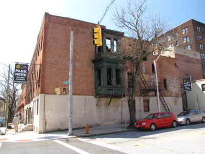 North facade facing Read Street, containing the bay window and the entrance to the parking garage.