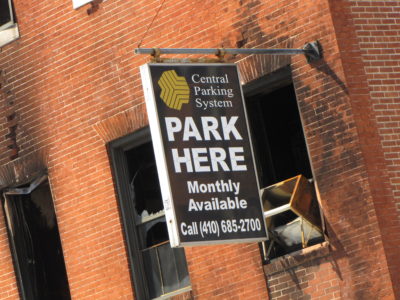 The "Central Parking System" sign on the east facade appeared undamaged following the fire.  From what I can tell, the parking garage is still in operation.