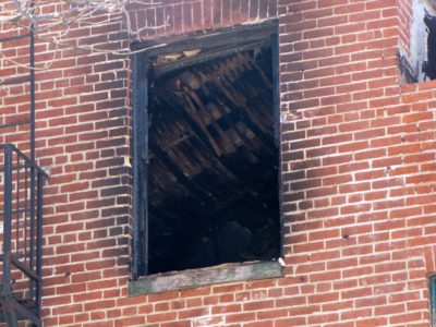 Sagging roof section on the third floor, west of the exterior fire escape stair.